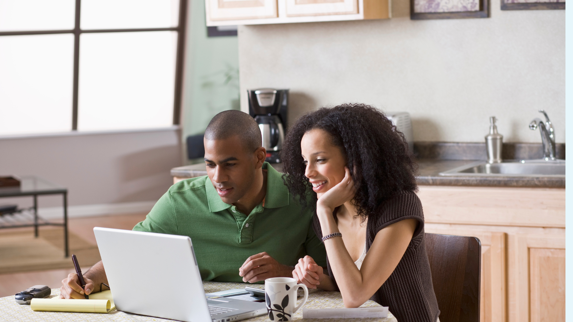 Couple looking at a computer screen